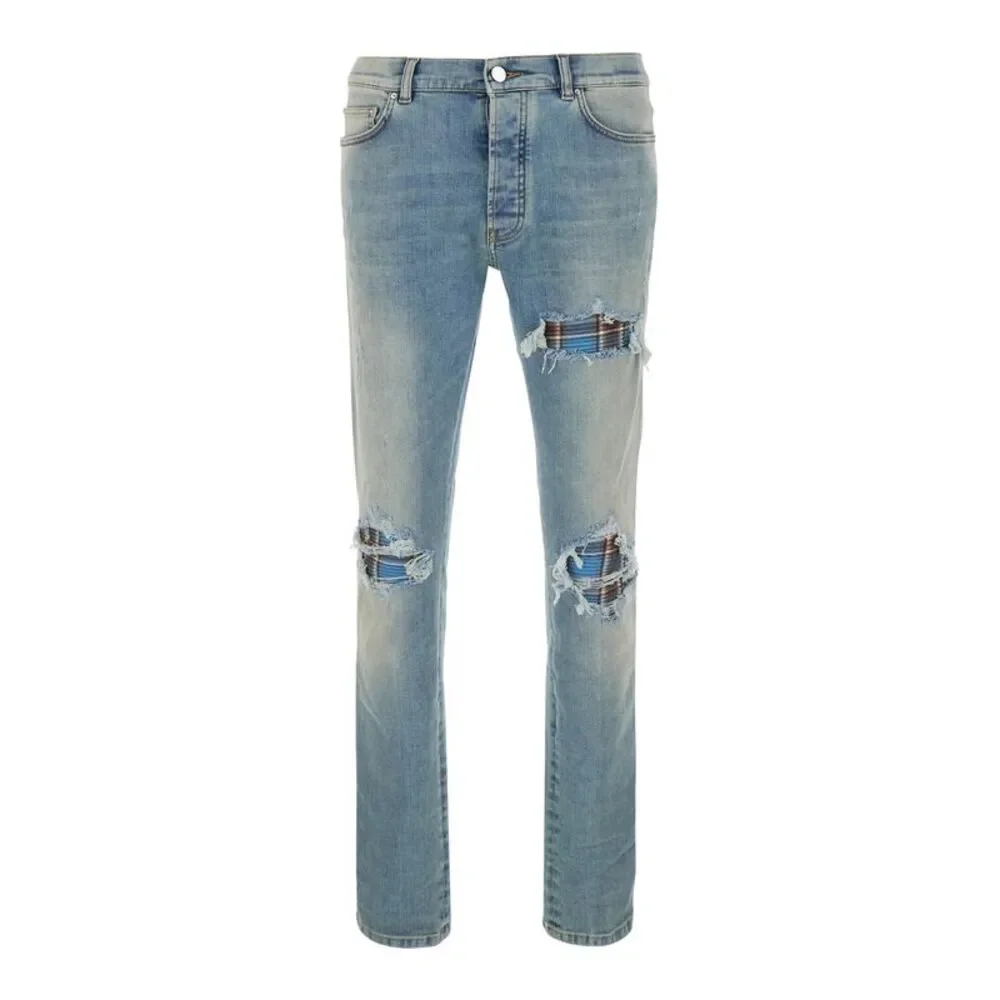 Amiri Men Light Blue Jeans With Ripped Details And Faded Design In Denim For Men